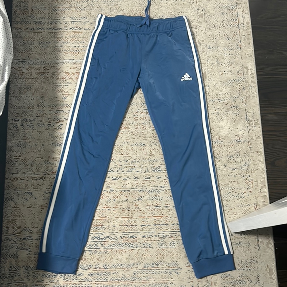 Blue and white Addidas track pants